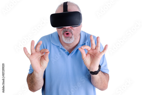 Man on white wearing virtual reality glasses photo