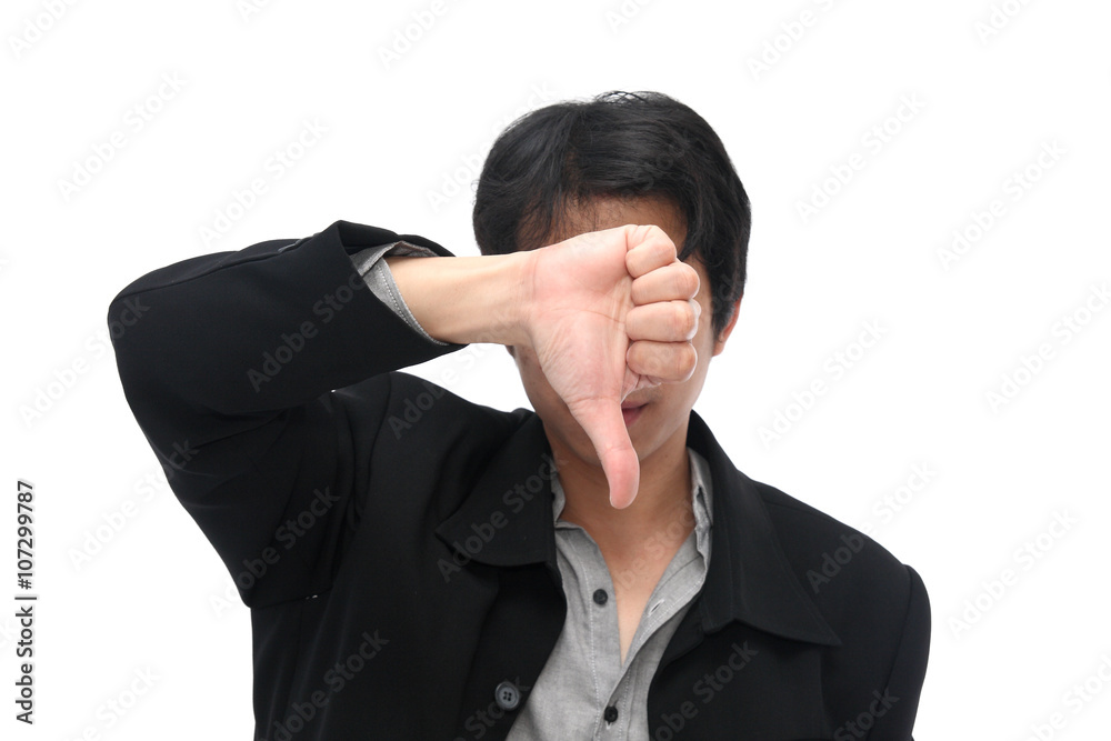 A businessman showing thumb down to reject on white isolated bac A businessman showing thumb down to reject on white isolated bac