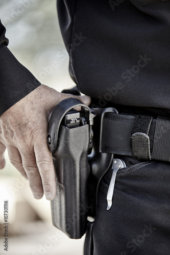 Billede på lærred police officer law enforcement man with gun closeup