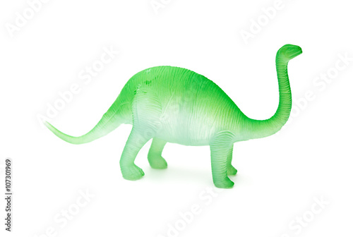 side view green plastic brachiosaurus toy on a white background © Freer