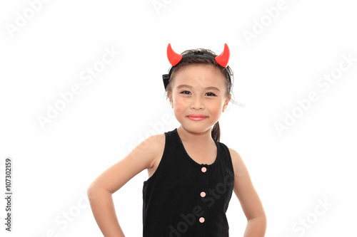 Scary cute little asian girl in black Halloween costume