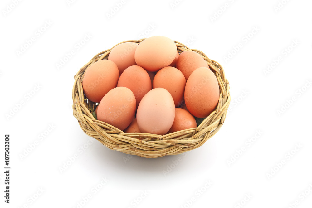 Easter egg in a basket isolated on a white background Easter egg in a basket isolated on a white background