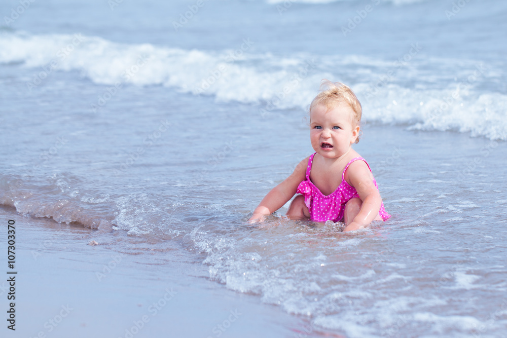 Little cute happy girl bathes in sea, Italy, outdoor Little cute happy girl bathes in sea, Italy, outdoor