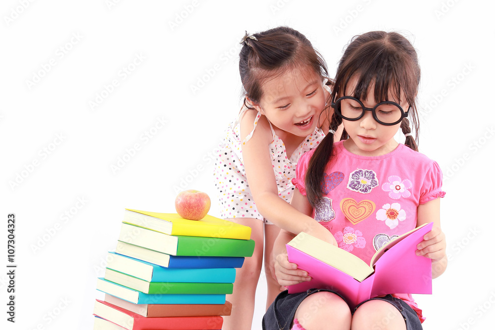 Two student little asian girl reading the book Two student little asian girl reading the book