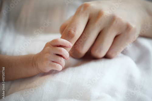 New Born Baby's Hand Gripping Mother Finger © meepoohfoto