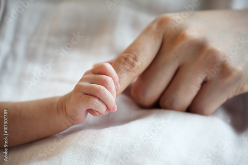 New Born Baby's Hand Gripping Mother Finger