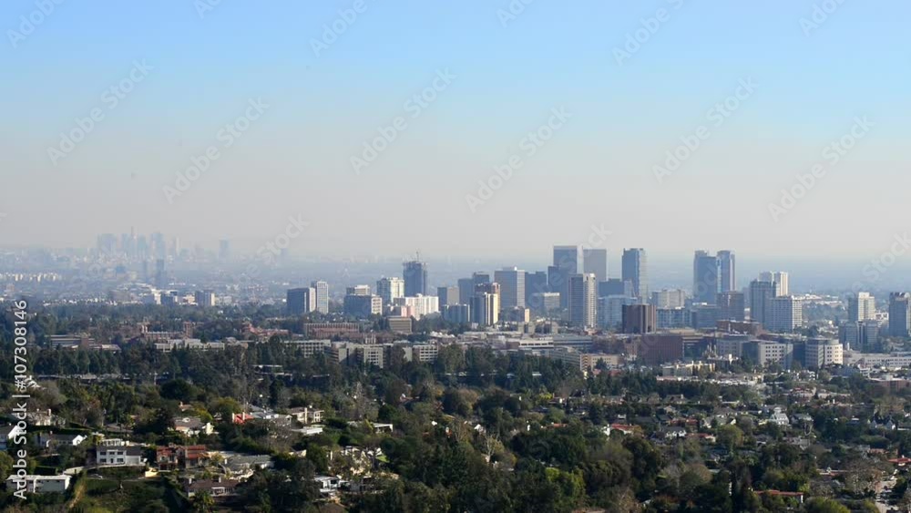 Downtown Los Angeles skyline over blue cloudy sky Downtown Los Angeles skyline over blue cloudy sky