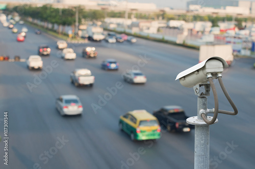 CCTV surveillance with traffic blur background