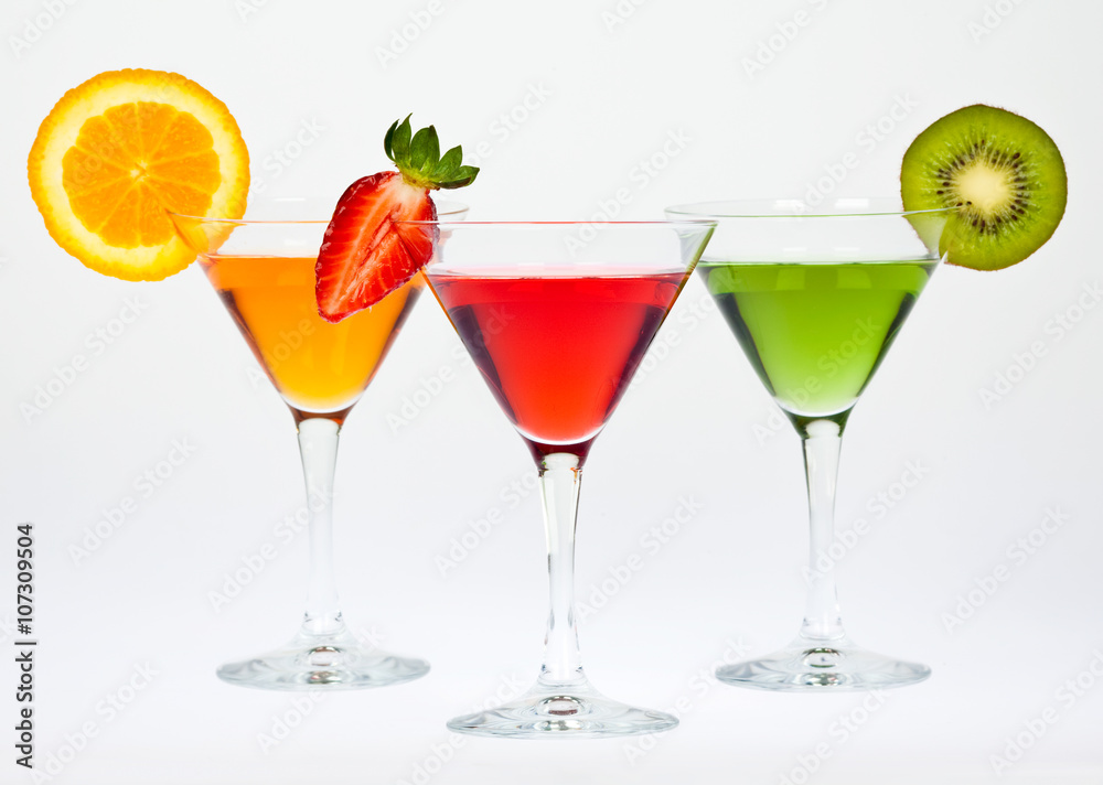 colored martini glass and fruit composition set isolated on white