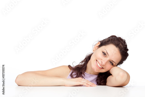 beautiful young brunette girl smile lean on white table isolated on white