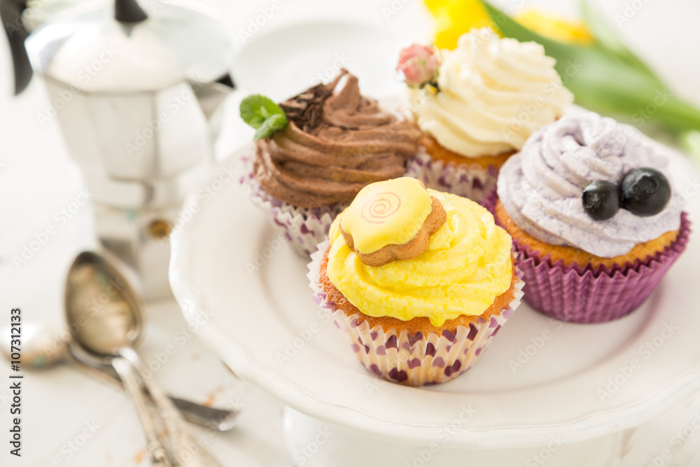 Selection of colorful cupcakes, white background