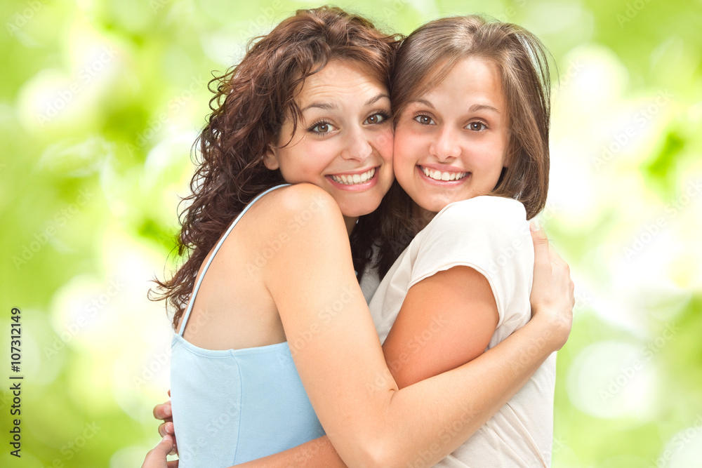 Fototapeta premium beautiful young girl couple hug smile outdoor