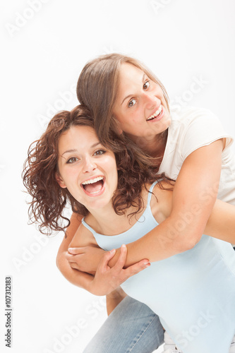 beautiful young girl couple hug smile isolated on white