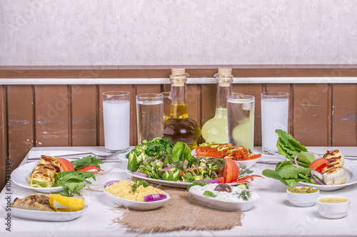 Turkish and Greek traditional rustic dinner table with raki, ouzo photo