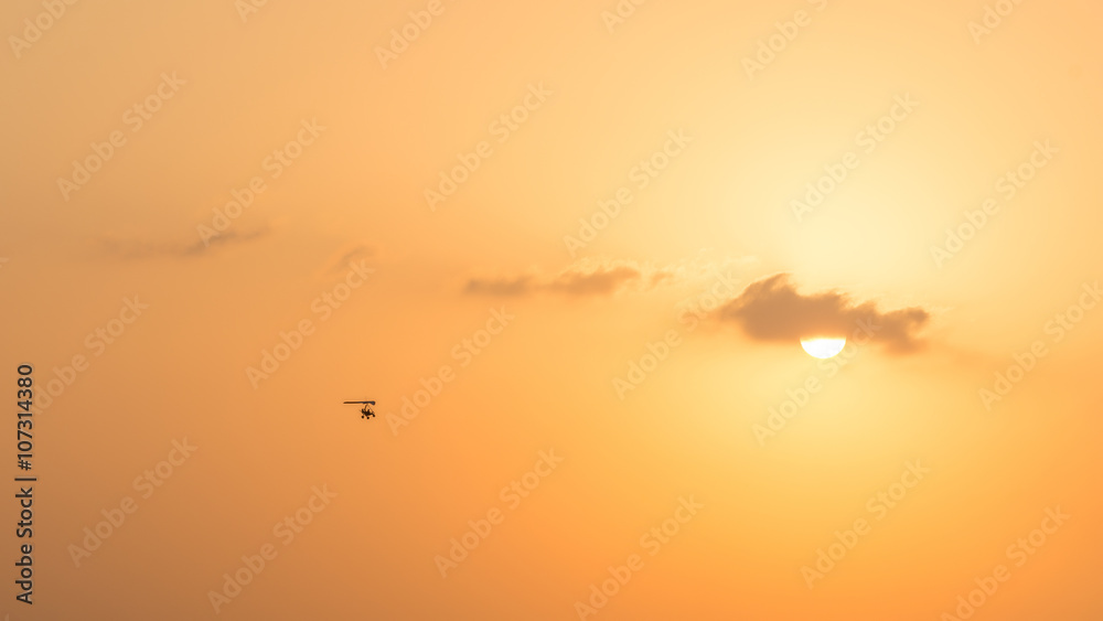hang glider flying in the sunset over Dubai desert
