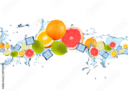 Fresh fruits falling in water splash, isolated on white background