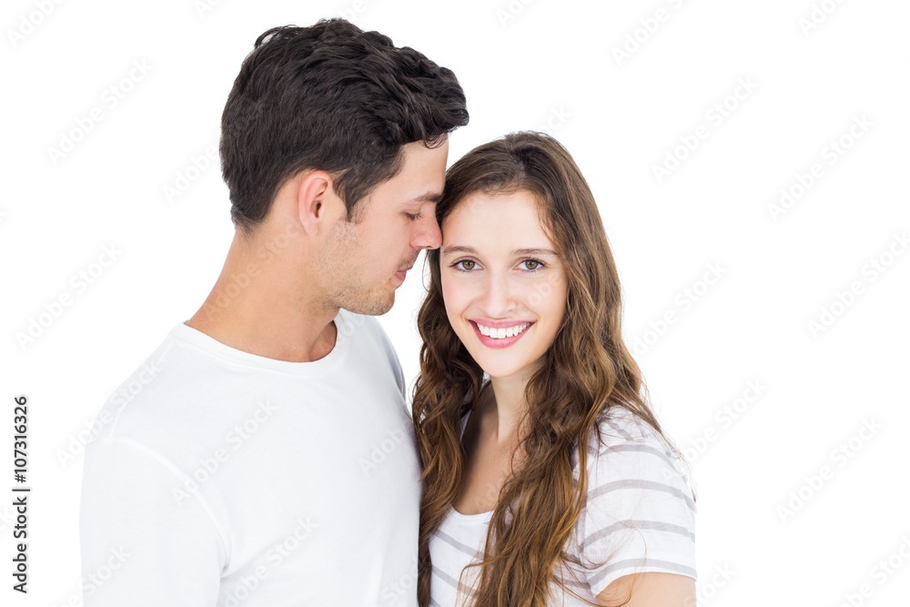 Cute couple embracing and looking the camera Cute couple embracing and looking the camera
