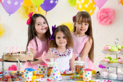 Happy little girls at birthday party
