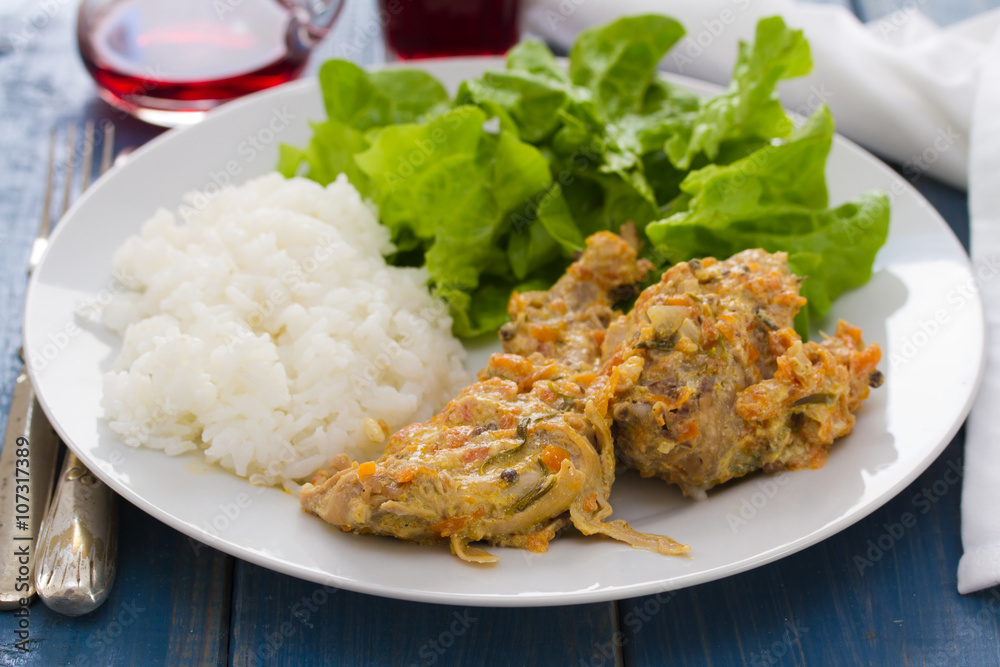 rabbit with boiled rice and salad on white plate rabbit with boiled rice and salad on white plate