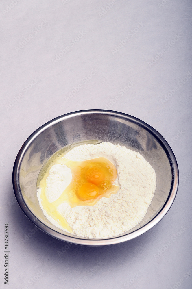 Bowl with flour and eggs Bowl with flour and eggs