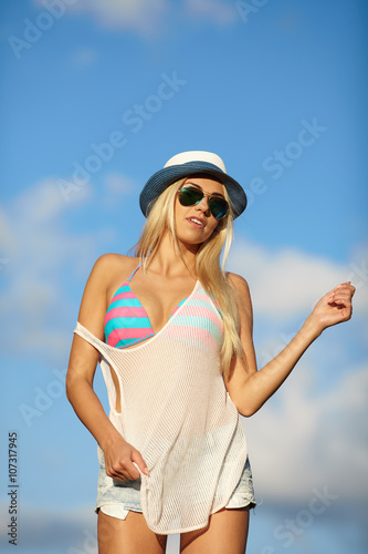 woman relaxing at the sky background . Summer hipster vacations