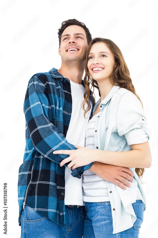 Couple standing and looking away Couple standing and looking away