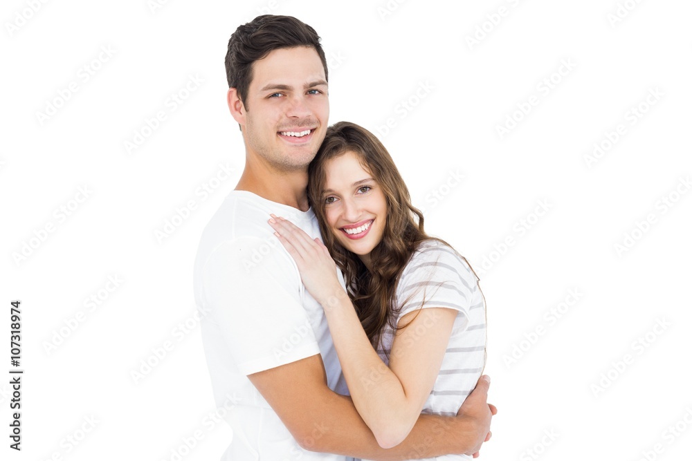 Cute couple embracing and looking the camera Cute couple embracing and looking the camera