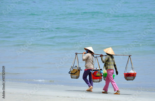 Two women vendors on the beach Vietnam 