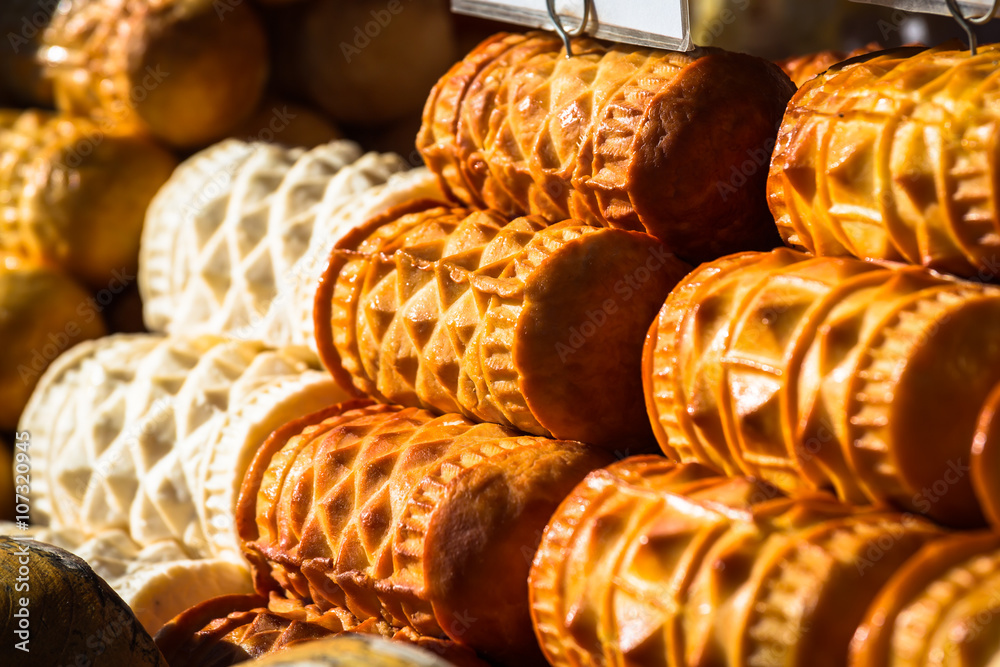 Traditional polish smoked cheese oscypek on outdoor market in Za
