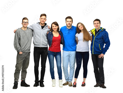 group of smiling friends staying together and looking at camera isolated on white background