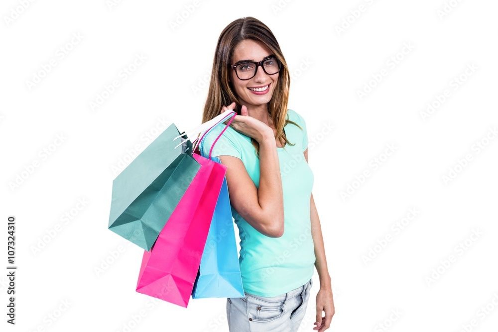 Portrait of smiling woman holding shopping bags Portrait of smiling woman holding shopping bags