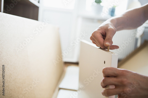 Canvas Print man hands assembling furniture