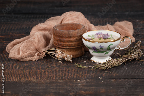 Tea with  lemon and dried flowers on the table