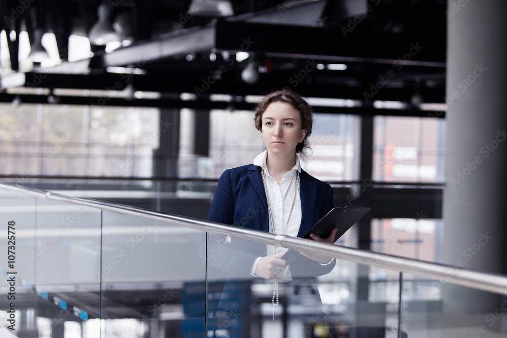 young pleasant business woman at the enterprise young pleasant business woman at the enterprise