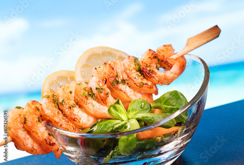 Prawns and salad with sea view photo