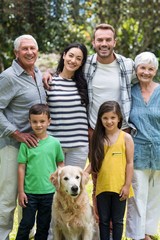 Happy family standing in a park