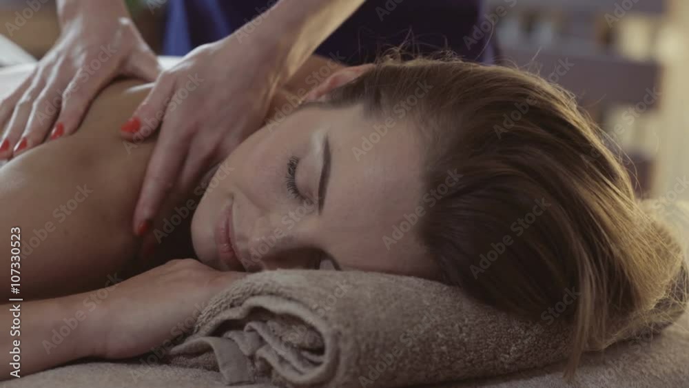 Massage concept. Beautiful young woman reciving relxing massage Massage concept. Beautiful young woman reciving relxing massage