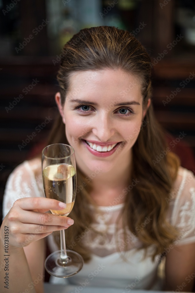 High angle portrait of happy woman holding champagne flute