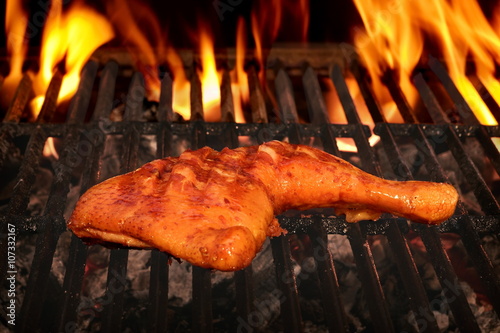 Chicken Leg Quarter Barbecued On The Hot Charcoal Flaming Grill
