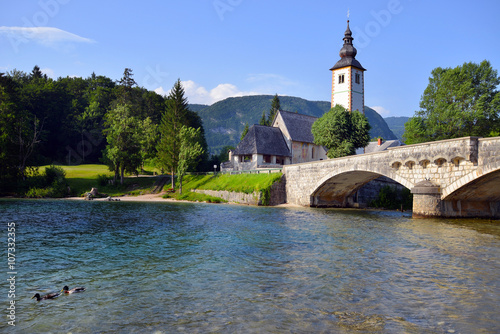 Old St. John church and stone bridge at Bohinj lake, Slovenia