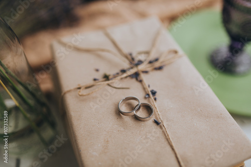 Wallpaper Mural wedding rings lie on a convolution of kraft paper wrapped with twine Torontodigital.ca