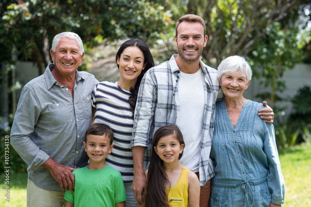 Portrait of happy family standing in a park Portrait of happy family standing in a park