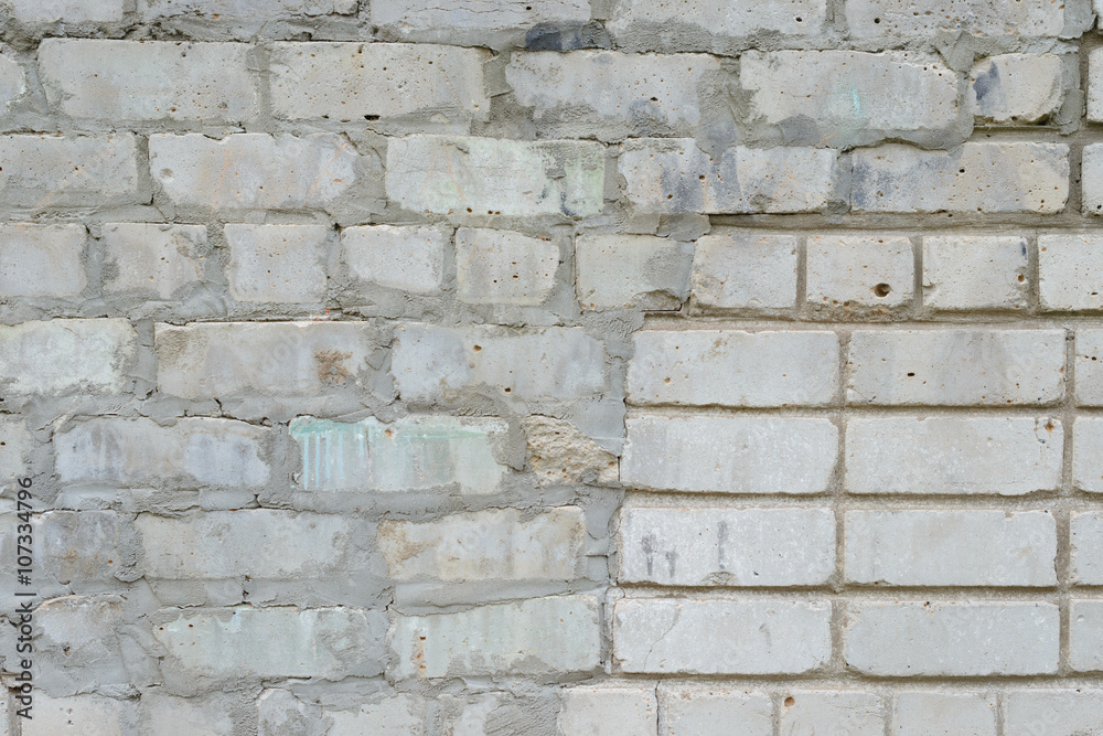 Fototapeta premium Brick texture with scratches and cracks