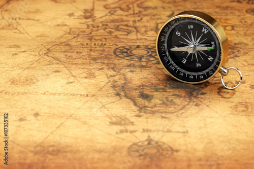 Close Up Of Magnetic Compass On The Old Map