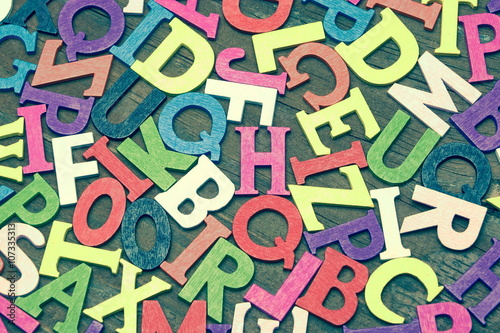 Tonned Random English Wooden Multicolored Letters On Wood Backg
