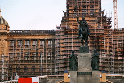 Restoration of the historical building of the National Museum in Prague on the famous Wenceslas Square, with a crane and silver metal scaffolding
