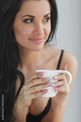 Sexy woman with cup of coffee 