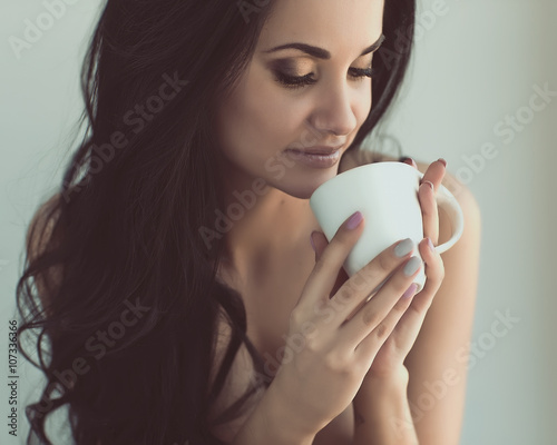 Sexy woman with cup of coffee 