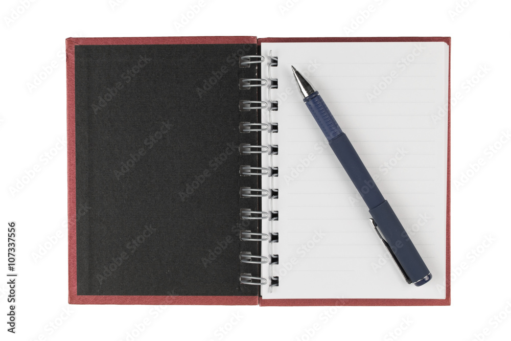 pen on a book on white background- clipping path. pen on a book on white background- clipping path.