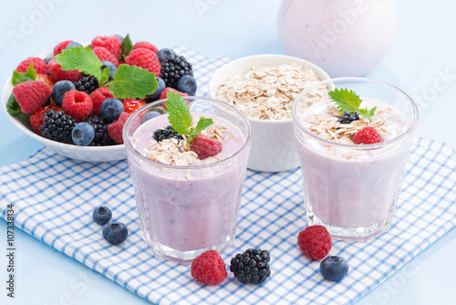 healthy berry smoothies with oatmeal in a glass, horizontal